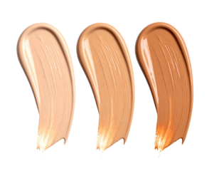 Three shades of foundation, swirled and textured, against a black background