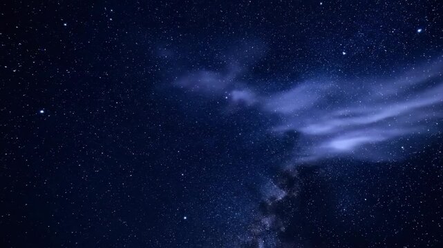 Starry night sky with ethereal clouds gracefully drifting across the cosmos, revealing twinkling stars in a serene timelapse spiritual, weather, ether