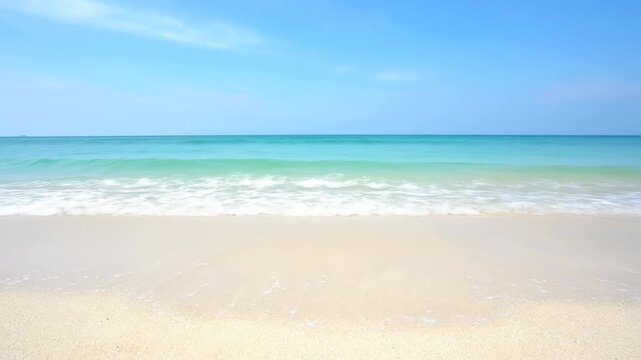 Smooth, shallow water waves gently ebb and flow over a pristine sand shoreline ocean, motion, waves