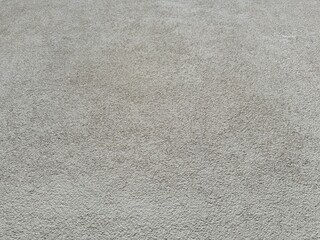 Light gray old plaster wall with rough texture. Grungy, neutral architectural background image for design, copy space, construction, vintage, rustic theme wallpaper 