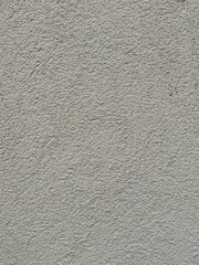 Vertical grey wall background with smooth, slightly textured surface. Neutral backdrop, cement old grunge wallpaper. Banner space for interior, architecture, design, and creative project