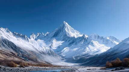Cinematic View of Snow Capped Mountain Range Under Clear Blue Sky in Winter