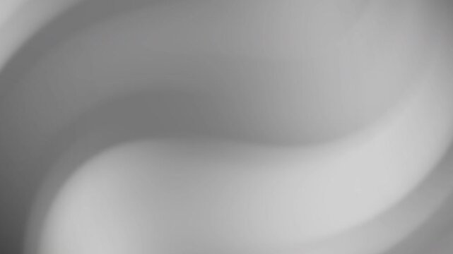 Blurred swirling gray gradient background with smooth transitions. Ideal for modern design projects requiring a subtle and stylish backdrop.