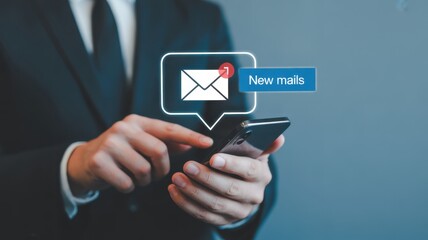 Email Alert: A professional individual is absorbed in managing a smartphone, the digital device reveals an email alert, symbolizing efficient communication. 