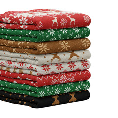 Stacked pile of festive knitted fabrics with christmas patterns