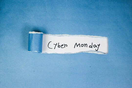 Cyber Monday text written on crack fold color paper, business concept, top view - Powered by Adobe