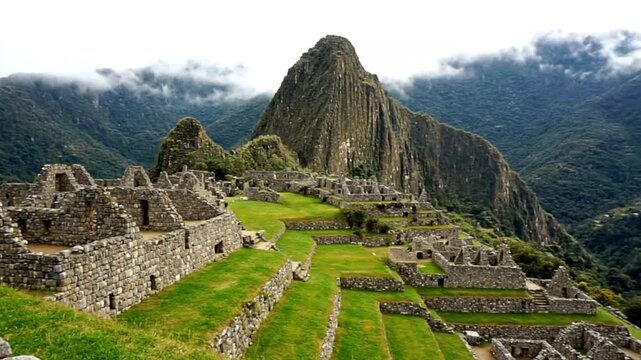 Majestic machu picchu ancient inca citadel nestled in the andes mountains, peru, with stone structures, green terraces, and misty peaks under a cloudy sky