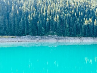 Black Lake in Durmitor National Park, Montenegro — a perfect fifty-fifty contrast between...