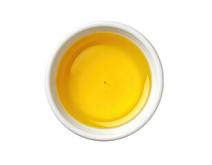 Small, round, white bowl filled with golden liquid