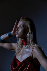 Fototapeta premium Young blonde woman radiates beauty in a stylish studio setting