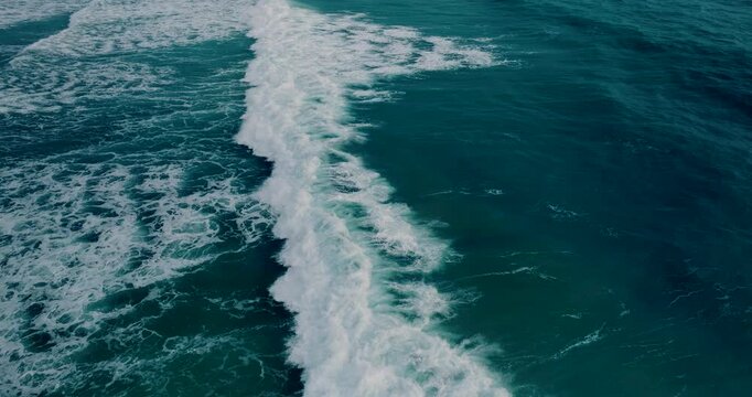 Phuket Thailand 2025 version. Aerial view Top down aerial view of beautiful giant blue ocean waves crashing and foaming with white wash background. High quality video 4K prores422