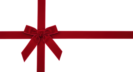 Isolated red velvet ribbon tied into a bow, festive decor for a gift or holiday project