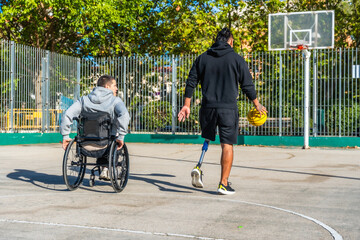 People with disabilities playing adaptive basketball outdoors