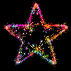 Kolorowe zimne ognie i fajerwerki układające się w kształt barwnej gwiazdy pięcio ramiennej na ciemnym tle. © Blue Pixel