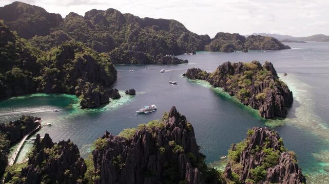 Drone Footage Of Twin Lagoon And Traditional Boats On Stunning Coron Island Scene, Philippines