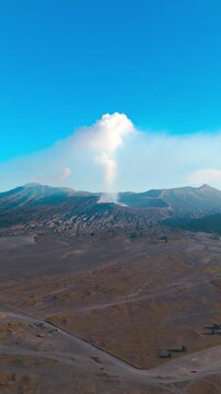 Vertical, aerial: Bromo-Tengger-Semeru volcano chain during the day in East Java, Indonesia, orbit drone shot
