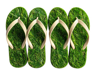 Four flip-flops with artificial grass soles, arranged in a row