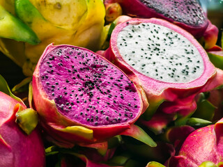 Colorful Pitaya fruits display freshness in a vibrant market