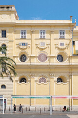 A summer day in Nice, the leisure of a traveler, the blazing sunlight, the beauty of a seaside retreat.