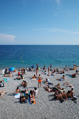A summer day in Nice, the leisure of a traveler, the blazing sunlight, the beauty of a seaside retreat.