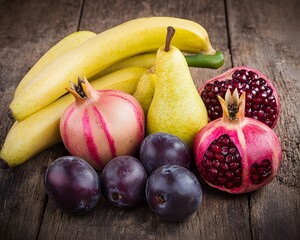 Assorted Fresh Fruits on Wooden Table- Bananas, Pears, Pomegranates, Plums