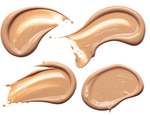 Four light beige foundation smudges, isolated on black