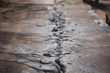 Cracked Concrete Surface with Detailed Texture and Weathered Appearance, Showcasing Damage and Wear, Perfect for Construction or Repair Projects