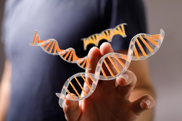 Close-up of a man's hand reaching towards the viewer, suggesting invitation, connection, or interaction.  Perfect for concepts of touch, help, and technology.