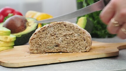 a woman cooks at home salmon and avocado sandwich cottage cheese or soft cheese whole wheat bread. keto diet food. recipe sandwich for the menu. takeaway food. proper nutrition diet for weight loss