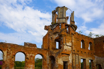 old medieval castle ruin under blue cloudy sky background