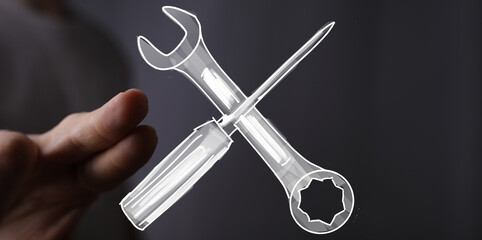 Concept image of a hand presenting a wrench and screwdriver, symbolizing repair, maintenance, and solutions.