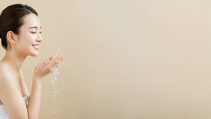 Asian Female Model Washing Face with Clear Skin and Text Space