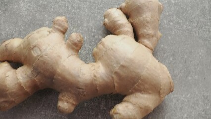 Fresh ginger on wooden background. Dry ginger. Sliced ginger with honey and lemon. Ginger root. Traditional alternative medicine, healing tea for immunity. Seasoning and spices concept. Copy space.