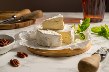 Camembert soft round cheese, served with honey, nuts and dried fruits. Cheese board