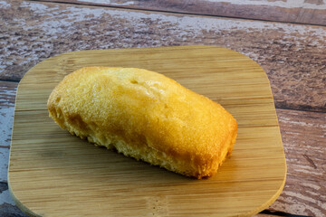 freshly baked cornbread on wooden surface