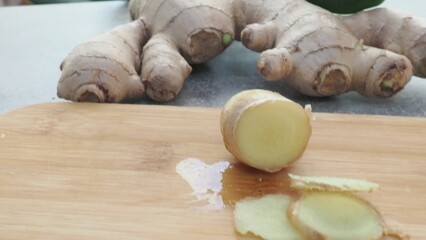 Fresh ginger on wooden background. Dry ginger. Sliced ginger with honey and lemon. Ginger root. Traditional alternative medicine, healing tea for immunity. Seasoning and spices concept. Copy space.