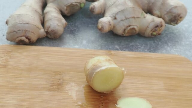 Fresh ginger on wooden background. Dry ginger. Sliced ginger with honey and lemon. Ginger root. Traditional alternative medicine, healing tea for immunity. Seasoning and spices concept. Copy space.