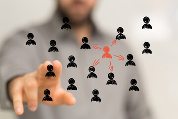 Hand reaching towards a central figure, symbolizing leadership, influence and team connection.