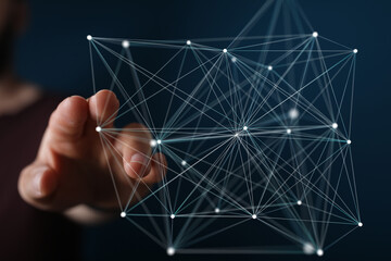 Abstract image of a hand interacting with a digital network, representing global connectivity and data flow.