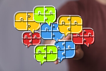 Colorful puzzle pieces shaped as speech bubbles. Teamwork, communication, and collaboration concept.