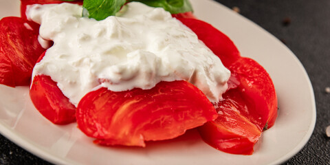 Salad strachatella and tomato portion size natural product tasty snack fresh delicious gourmet food background on the table rustic top view copy space keto and paleo diet