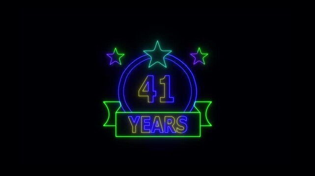 41 Years Anniversary Celebration Neon Sign with Stars and Glowing Banner Highlighting Milestone Achievement and Success.