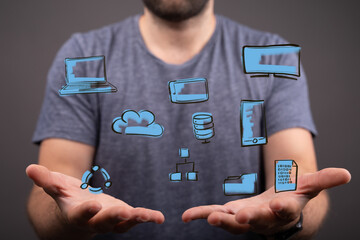 Image of a man holding various digital network icons, representing cloud computing, data, and technology.