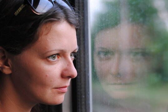 girl portrait by the window with reflection