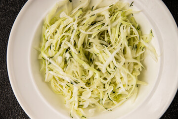 Cabbage salad coleslaw vegetables dish natural product tasty snack fresh delicious gourmet food background on table rustic top view copy space keto and paleo diet vegan and vegan food