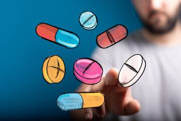 Image of hand interacting with colorful medication, perfect for healthcare, pharmacy, or medical concepts.