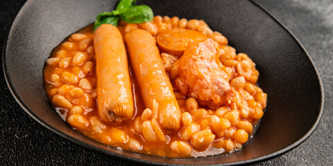 Cassoulet beans with meat and sausage french cuisine vegetables dish natural product tasty snack fresh delicious gourmet food background on the table rustic top view copy space