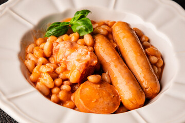 Cassoulet beans with meat and sausage french cuisine vegetables dish natural product tasty snack fresh delicious gourmet food background on the table rustic top view copy space