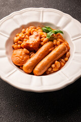 Cassoulet beans with meat and sausage french cuisine vegetables dish natural product tasty snack fresh delicious gourmet food background on the table rustic top view copy space