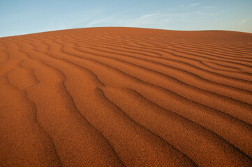 Natural designs and shapes in the sand, caused by the wind.